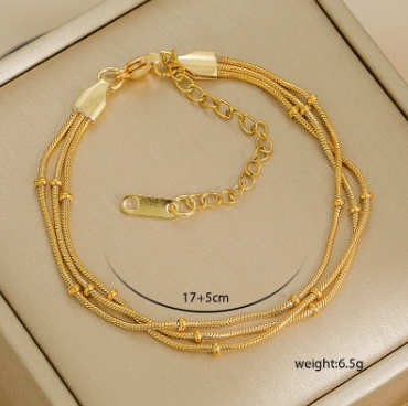 Triple Strand Gold Coil Bracelet – Minimal Streetwear | Glisance